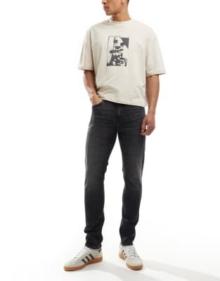 Монохромные черные джинсы скинни ASOS DESIGN с обычной талией и пятью карманами 10043633