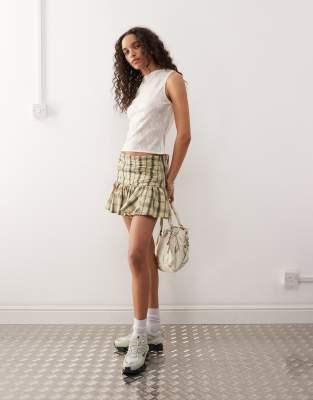 Мини-юбка в клетку с необработанным краем от COLLUSION, молочного цвета, средней посадки 11037519