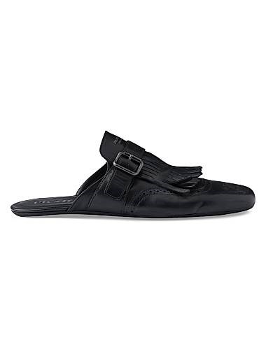 Мюли с ремешком и кисточками, выполненные из 100% телячьей кожи с перфорацией и тонкой резиновой подошвой от Prada. 11034730