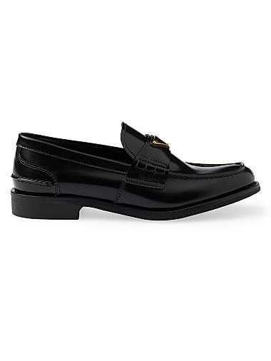 Замшевые лоферы Prada с треугольным логотипом и каблуком 20 мм 11021003