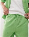 Светло-зеленые спортивные брюки Collusion с функциональными карманами из мягкого хлопка 11169533