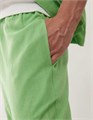 Светло-зеленые спортивные брюки Collusion с функциональными карманами из мягкого хлопка 11169533